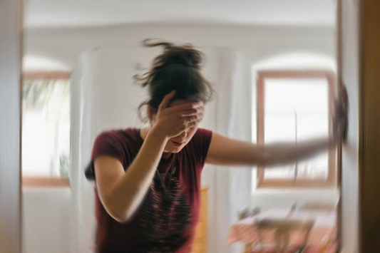 a woman suffers from dizziness and motion sickness