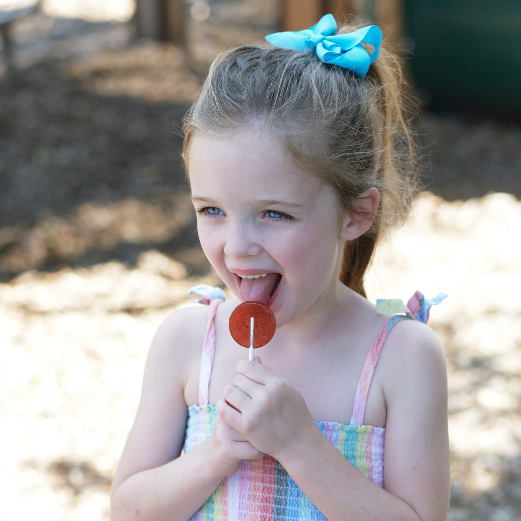 MommaBear Organics lollipop enjoyed by child