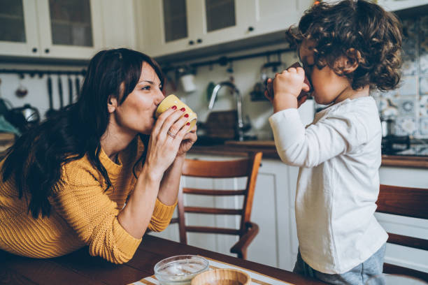 mom and child drinking natural relief for cough