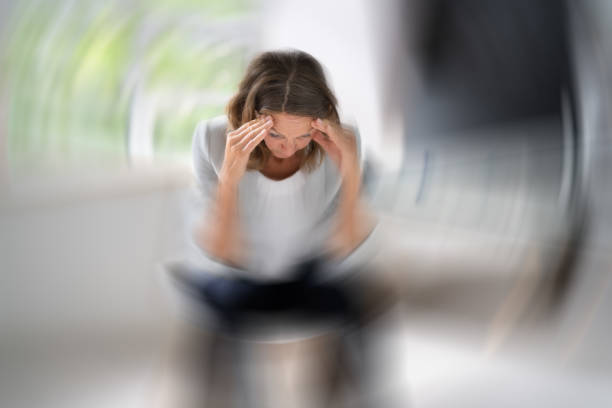 a person feeling dizzy
