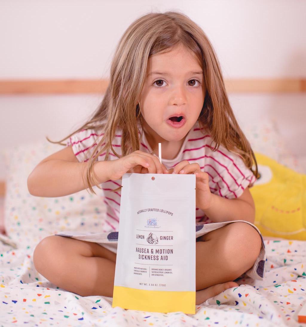A girl holding a ginger candy