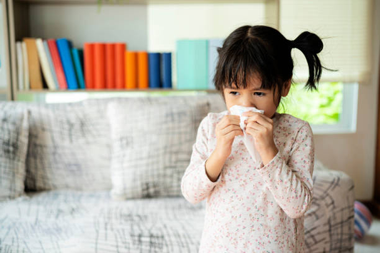 A kid suffering from allergy-induced cough