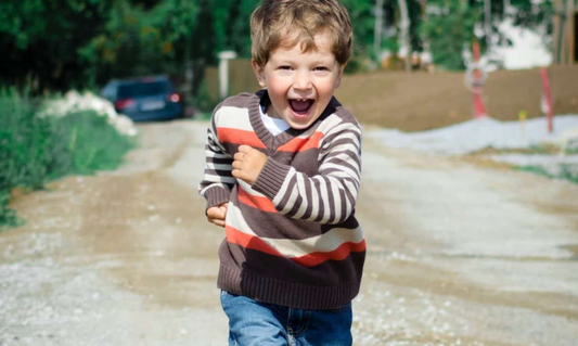 Child running in the field