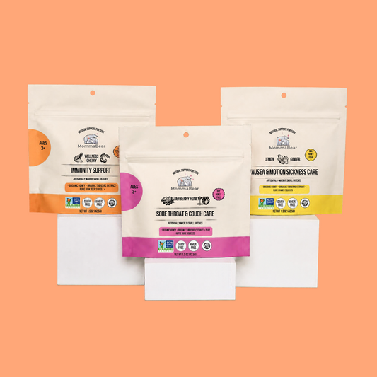 Three stand-up pouches displayed on a solid peach background. 